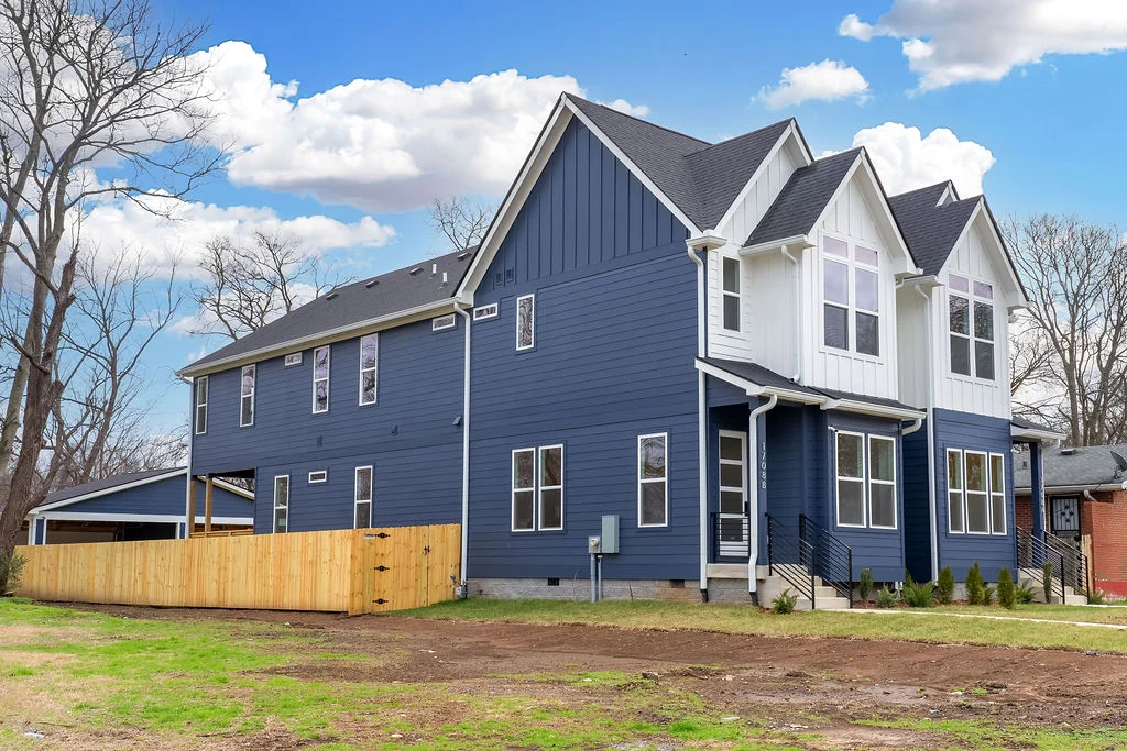 Completed paired homes at 1708 A and B 17th Avenue North, with blue siding and white gables
