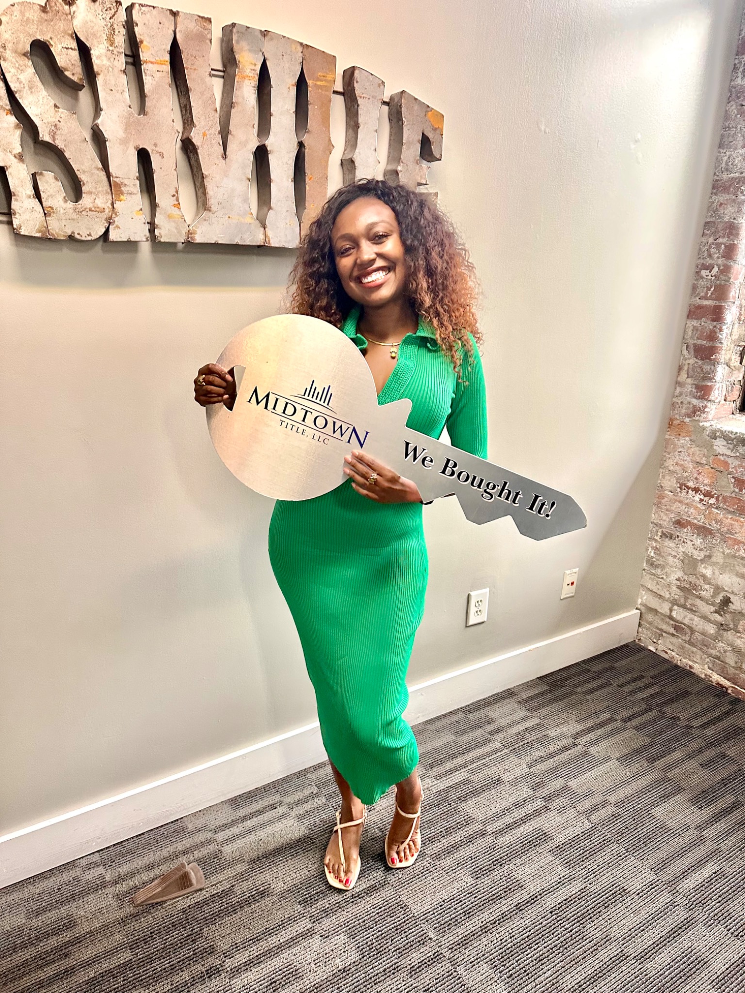 Jessica Grace Williams smiling at an investment property closing